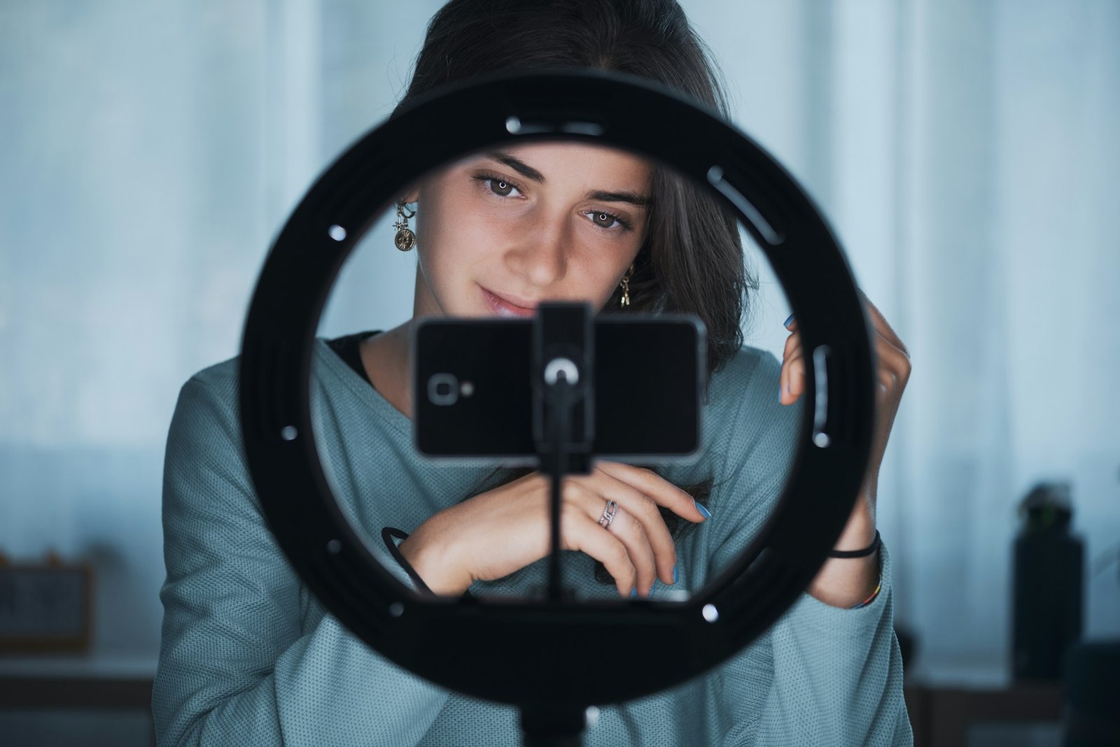 Young woman live streaming a video